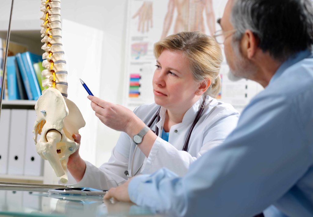 Chiropractic Doctor explaining injury to patient